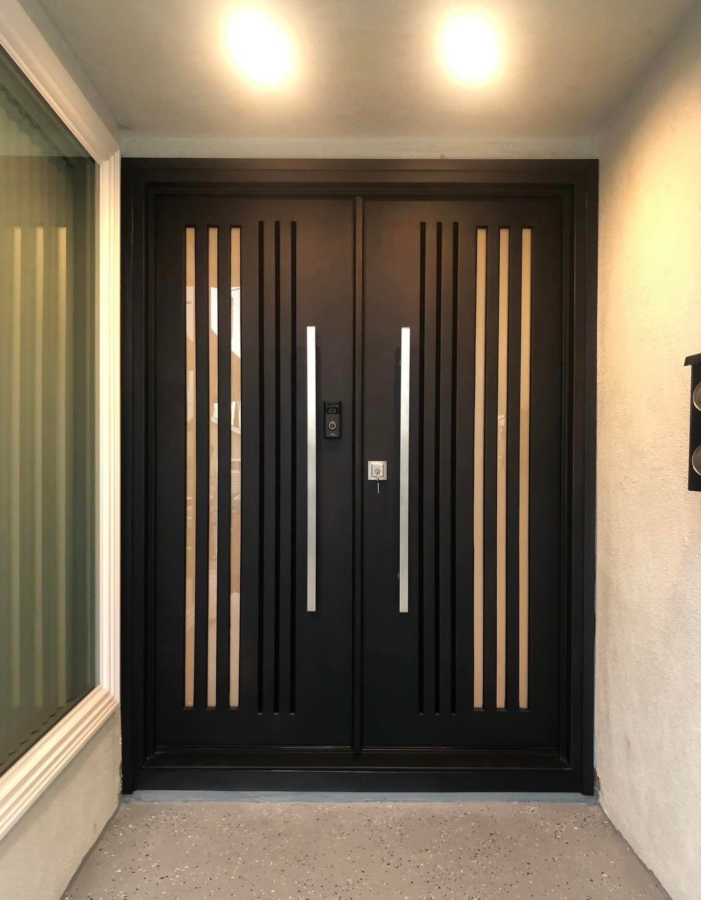 Security entrance door with vertical stripes